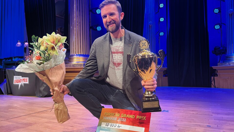 Matthew Tompkins with his first prize trophy and winner's check.